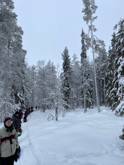 A group of people walking in the snow

Description automatically generated with low confidence